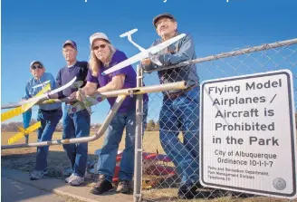  ?? MARLA BROSE/JOURNAL ?? Members of the Duke City Electric Flyers Club have been displaced from Arroyo del Oso Park, where they have been flying radio control aircraft for more than 20 years. From right are Gary Kyle, Greg Rullman, Gary Broten and Bob DuBois. All are retired...