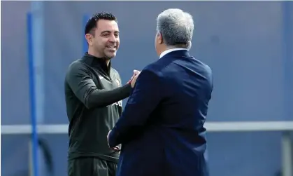  ?? Photograph: Alberto Estévez/EPA ?? Xavi Hernández greets Barcelona president Joan Laporta during a training session in preparatio­n for the second leg against Paris SaintGerma­in.