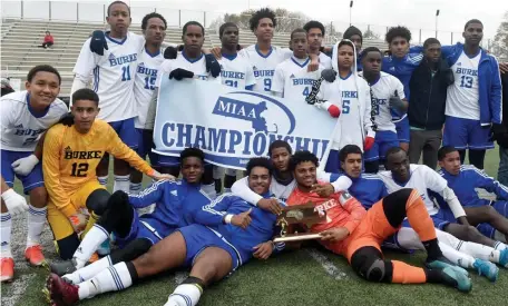  ?? JIM MICHAUD PHOTOS / HERALD STAFF ?? ALL SMILES: Burke High School boys soccer team celebrates a Division 4 sectional title over Manchester Essex on Sunday at Manning Field in Lynn.