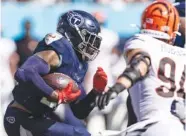  ?? AP PHOTO/WADE PAYNE ?? Tennessee running back Derrick Henry (22) runs for yardage during Sunday's game against Cincinnati in Nashville.