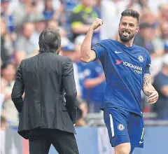  ?? AFP ?? Chelsea striker Olivier Giroud, right, celebrates with manager Antonio Conte after scoring the opening goal against Southampto­n.