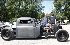  ??  ?? Marilyn and Roger Pum, Allentown, pose with their owner-built truck, a 1948 Ford truck cab with a highly modified Plymouth 283Chevy engine.