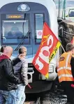  ??  ?? The long haul: Rail workers of CGT union demonstrat­e in Hendaye, south-west France