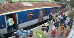  ?? D&CDR ?? The Derry Girls board the Class 450 at Downpatric­k.