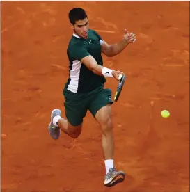  ?? ?? Spain’s Carlos Alcaraz hits a forehand back to Alexander Zverev during his final triumph in Madrid