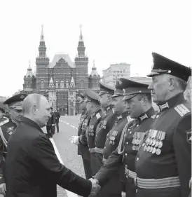  ??  ?? Russian President Vladmir Putin greeting the commanders of the contingent­s participat­ing in the parade in this file photo