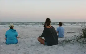  ??  ?? Yali Zawady (at left in photo below right) stands with SC CF's Kelly Sloan. The two use beach meditation to spark activism in the sur vival of Southwest Florida's sea turtles. Turtle nesting runs April though October . Sea turtles were federally...