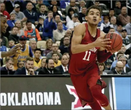  ?? THE ASSOCIATED PRESS ?? FILE - In this file photo, Oklahoma’s Trae Young drives to the hoop during overtime of an NCAA men’s college basketball tournament firstround game against Rhode Island,in Pittsburgh. Young is a member of the Associated Press NCAA college basketball...