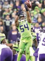  ?? Stephen Brashear/Associated Press ?? ■ Seattle Seahawks' Bobby Wagner leaps to block a field goal attempt by Minnesota Vikings' Dan Bailey on Monday in Seattle.