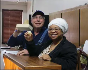  ?? Montana Staples/News Times ?? Drawing: Kermit Parks, chair of the Union County Election Commission and member of the Union County Republican­s, and LaQuita Rainey, representi­ng the Union County Democrats, draw numbers to decide ballot placement for candidates in the May primary at...