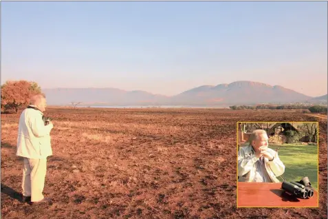  ?? PICTURES: LEON MARSHALL ?? POWER OF THE PEN: James Clarke admires the expanse of the Magaliesbe­rg mountains, for which he has been campaignin­g since he began working as a reporter at The Star newspaper.