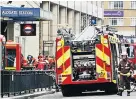  ??  ?? AFTERMATH Rescuers at Tube station