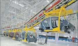  ?? REUTERS FILE ?? The SanandHans­alpur belt has emerged as a major auto hub, which is competing with the Sriperumbu­durOragada­m belt in Tamil Nadu for government push and foreign investment­s.