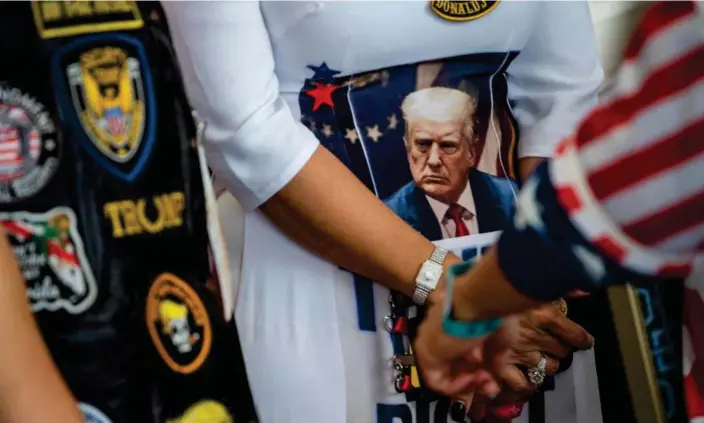  ?? Photograph: Roberto Schmidt/AFP/Getty Images ?? Donald Trump supporters attend the 2023 CPAC conference in National Harbor, Maryland, on Saturday.