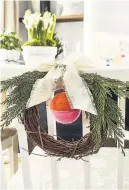  ??  ?? Personal touch Make your chairs festive with a wreath