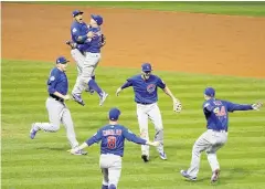  ?? AP ?? Chicago Cubs players celebrate their World Series win.