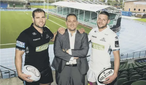  ??  ?? Finn Russell, right, makes his first domestic appearance of the season this afternoon. Earlier this week he was joined at Scotstoun by team-mate Fraser Brown, left, and Mark Cook, the managing director of CDM, the new sponsor of the stadium’s east stand.