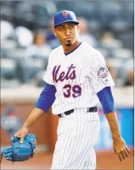  ?? Kathy Willens / Associated Press ?? Mets relief pitcher Edwin Diaz walks off the field after the top of the 10th inning of the continuati­on of a rain-suspended game against the Cardinals on Friday. The Cardinals defeated the Mets 5-4.