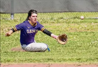  ?? Jim Franco / Times Union ?? Saratoga Central Catholic right fielder Kameron Cox makes a sliding effort against Schuylervi­lle during the Phil Waring Memorial Tournament on Saturday.
