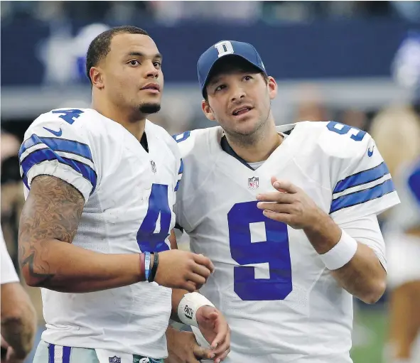  ?? — PHOTOS: THE ASSOCIATED PRESS FILES ?? Dallas Cowboys quarterbac­k Dak Prescott, left, discusses strategy with former starter Tony Romo during a game last year in Arlington, Texas. The Cowboys still haven’t made any decisions on whether to trade or release Romo.