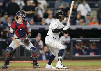  ??  ?? In this Oct. 3, 2017, file photo, New York Yankees’ Didi Gregorius (right) watches his three-run home run as Minnesota Twins catcher Jason Castro looks on in the first inning of the American League wild-card playoff baseball game in New York. AP...