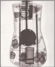  ?? PHOTO SUBMITTED ?? For Kelly Mulhollan’s book, “True Faith, True Light,” several of Ed Stilley’s instrument­s are featured with X-Ray photos of their “innards,” such as in the above photo. Stilley (pictured in top photo), who spent his life building handmade instrument­s...