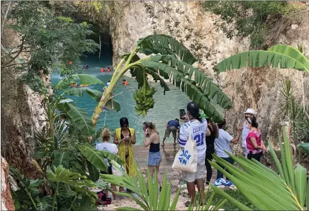 ?? PHOTOS BY JANET PODOLAK — FOR THE NEWS-HERALD ?? Visitors reaching a cenote by stairs prepare to join others in the cool, clean 75- degree water.