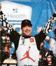  ?? Colin E. Braley / Associated Press ?? Kurt Busch celebrates in victory lane after winning a NASCAR Cup Series race May 15 at Kansas Speedway in Kansas City, Kan.