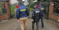  ??  ?? CRIME CALL: Gardai and NCA officers at the house in Tamworth