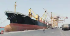  ?? (Abduljabba­r Zeyad/Reuters) ?? A CARGO SHIP is shown docked in March at Hodeidah, Yemen, where fighting has added to existing concerns about the safety of shipping in waters already plied by Somali pirates.