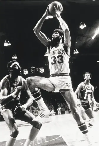  ?? NBA Photos / NBAE / Getty Images 1971 ?? Milwaukee’s Kareem Abdul-Jabbar drives against the Lakers’ Wilt Chamberlai­n in 1971, the year the Bucks won their only championsh­ip. Four years later, Abul-Jabbar was traded to L.A.