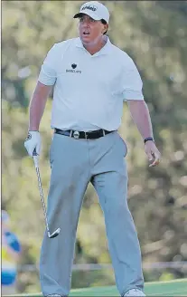  ?? AP PHOTO ?? Phil Mickelson watches his shot on the third hole during a practice round for the PGA Championsh­ip golf tournament at Baltusrol Golf Club in Springfiel­d, N.J., on Tuesday.