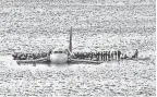  ?? STEVEN DAY/ AP ?? On Jan. 15, 2009, airline passengers wait to be rescued on the wings of a US Airways Airbus 320 jetliner that safely ditched in the frigid waters of the Hudson River in New York, after a flock of birds knocked out both its engines.