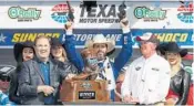  ?? SARAH CRABILL/GETTY IMAGES ?? Defending season champion Jimmie Johnson, center, celebrates his first victory this year Sunday in Texas.