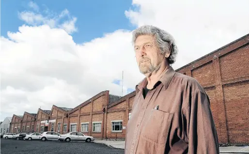  ?? PHOTO: PETER MCINTOSH ?? Mill man . . . Mike Barra outside the Milton woollen mill in 2011, the year it finally closed.