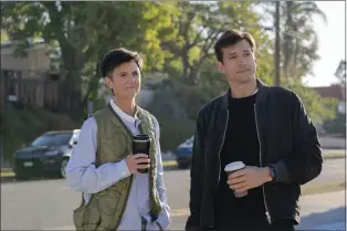  ?? ERIN SIMKIN — NETFLIX VIA AP ?? Tig Notaro, left, and Ashton Kutcher in a scene from “Your Place or Mine.”