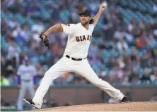  ?? Thearon W. Henderson / Getty Images ?? Giants starter Madison Bumgarner held the Dodgers to one run in six innings. He’s 15-12 against them in his career.