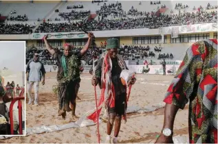  ?? ?? Wrestlers get ready for a match at the National Arena in Pikine, Senegal, on Dec 24, 2023. — AFP photos