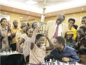  ?? — DISNEY ?? Madina Nalwanga, left, and David Oyelowo in Queen of Katwe, which blends chess with Uganda’s mean streets.