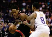  ?? ASSOCIATED PRESS ?? TORONTO RAPTORS GUARD DEMAR DEROZAN drives on Phoenix Suns guard Tyler Ulis (8) in the first quarter during Wednesday in Phoenix.