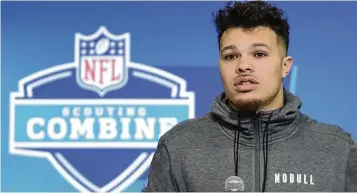  ?? DARRON CUMMINGS / AP ?? Iowa tight end Erick All speaks at the NFL Scouting Combine on Thursday in Indianapol­is. The Fairfield High School grad said his surgically repaired knee feels great, but he isn’t yet ready to work out for NFL teams.