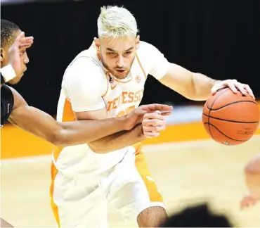  ?? AP FILE PHOTO/ CALVIN MATTHEIS ?? Tennessee guard Santiago Vescovi scored 16 points, grabbed seven rebounds and had five assists in the Vols’ 102-66 victory over Saint Joseph’s on Monday night at Thompson-Boling Arena.
