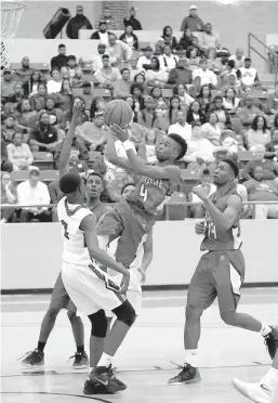  ?? Submitted photo by Terrance Armstead for the Texarkana Gazette ?? Taviron Oliver drives past a Wildcat defender Saturday in Arkansas High’s first 6A conference game at El Dorado, Ark. The Wildcats won, 91-78.