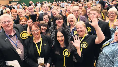  ??  ?? Celebratio­n Rutherglen’s new MP Margaret Ferrier, centre, with her supporters