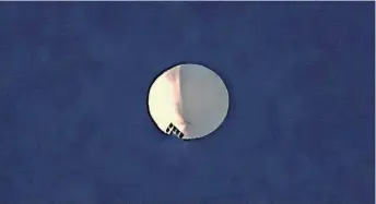  ?? LARRY MAYER/THE BILLINGS GAZETTE VIA AP ?? The high-altitude balloon floats over Billings, Mont., on Wednesday.