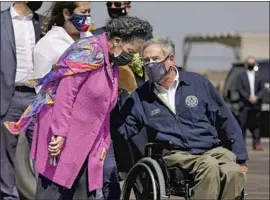  ?? Patrick Semansky Associated Press ?? TEXAS GOV. Greg Abbott, seen Friday with Rep. Sheila Jackson Lee, said Tuesday that “removing statewide mandates does not end personal responsibi­lity.”