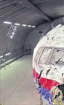  ??  ?? The wreckage of Malaysia Airlines Flight MH17 being pieced