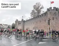  ??  ?? Riders race past Cardiff Castle