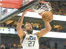  ?? RICK BOWMER/AP ?? The Jazz traded Rudy Gobert, above, to the Timberwolv­es on Friday in a deal that included four first-round picks.