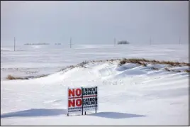  ?? ?? A sign expressing opposition to the proposed carbon pipeline in Valley Springs, S.D.., on Dec. 20. Landowners opposed to the pipeline have been placing signs on their property.